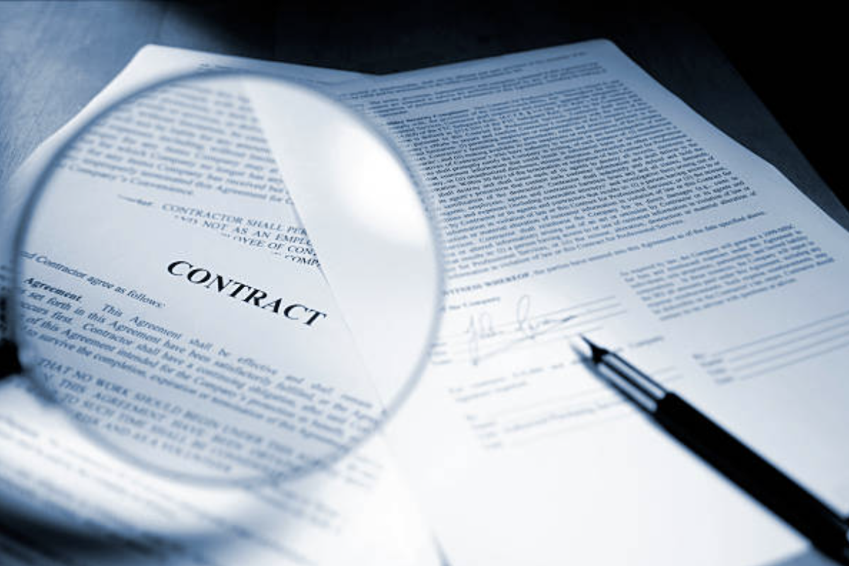 Attorney drafting and reviewing international contracts involving Ukrainian law